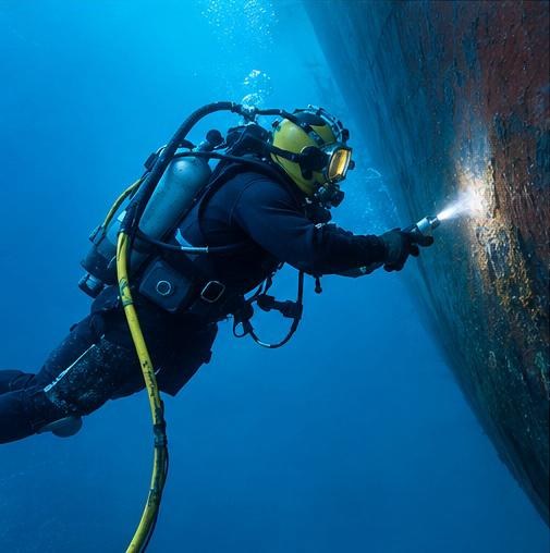 Diver inspecting a vessel hull